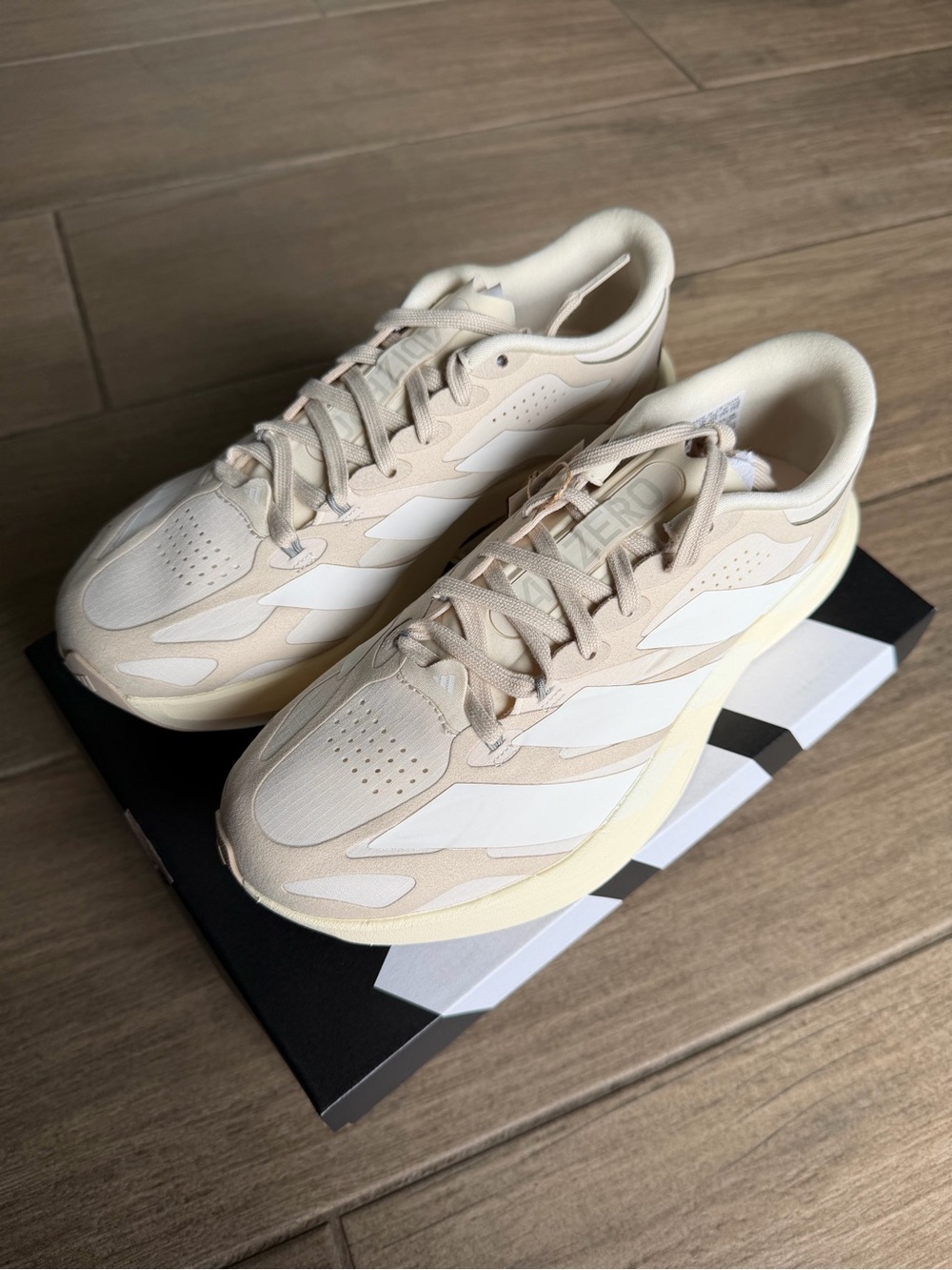 Adidas ADIZERO EVO SL EXO SUEDE
LIGHTSTRIKEPRO RUNNING SHOES
